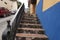 Iconic and colorful old houses and narrow streets typical of El Hatillo, where few people can be seen walking down the street