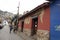 Iconic and colorful old houses and narrow streets typical of El Hatillo, where few people can be seen walking down the street