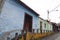 Iconic and colorful old houses and narrow streets typical of El Hatillo, where few people can be seen walking down the street