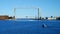 Iconic Duluth Minnesota aerial lift bridge with small boat ferrying portable toilets across the harbor