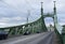 Iconic green iron bridge in Budapest, spanning the Danube River. Architectural elegance merging with historical charm