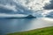 Iconic island under cloudy sky in Faroe Islands