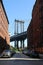 Iconic Manhattan Bridge and Empire State Building view from Washington Street in Brooklyn