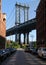 Iconic Manhattan Bridge and Empire State Building view from Washington Street in Brooklyn