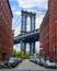 Iconic Manhattan Bridge and Empire State Building view from Washington Street in Brooklyn, New York