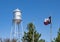 Iconic Marfa water tower on a sunny day with a bright blue cloudless sky.