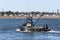 Iconic New Bedford image with fishing vessel, factory, tenements and church steeple