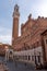 The iconic Palazzo Pubblico at the Piazza del Campo in downtown Siena