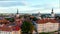 Iconic panning aerial view of Tallinn Old Town and Toompea hill on a sunny summer evening, Estonia