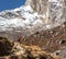 Iconic Portrait of Nepalese Mountain Guide staying on Footpath