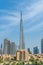 Iconic portrait shot of Burj Khalifa and Dubai Skyline during the day with and other skyscrapers in the Middle East with blue sky