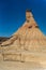 Iconic pyramid formation in Bardenas desert with fence