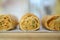 Iconic rustic Romanian and Moldavian pies with spinach and cheese filing on a light colored wooden boar