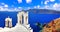 Iconic Santorini - most beautiful island in Europe. view with traditional churches in Oia village. Greece