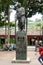 Iconic statue of Simon Bolivar in Plaza Bolivar in El Hatillo and people, children,women and men spending time playing and resting