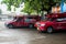 Iconic traditional red truck taxis parked and waiting for the passenger at Arcade bus station in Chiang Mai, Thailand