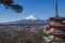 The iconic view of Mount Fuji with the red Chureito pagoda and Fujiyoshida city from Arakurayama sengen park in Yamanashi