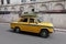 The iconic yellow ambassador taxi Kolkata with a grass roof
