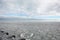 Icy Chicago Winter Lake Michigan, Cloudy With a Sliver of Sky Blue Peeking Through and a Line of Flying Geese Over the Horizon