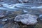 Icy cold water flows down the Poudre River on a chilly morning