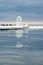 Icy lighthouse and tourists