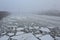 Icy Moscow river in foggy weather