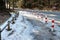 Icy road and pavement in the moddle of forest