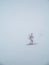 Icy ski lift with inexperienced skier in in thick fog. Skiers in the fog on a snowy mountain