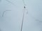 Icy ski lift with inexperienced skier in in thick fog. Skiers in the fog on a snowy mountain