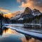 Icy snowy winter lake mountain sky sunset glow