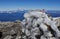 Icy Windbreak on Mountain Summit with American Flag