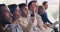 Id like to share some thoughts as well. a young businessman raising his hand during a conference in an office.