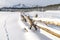 Idaho winter nature with a pole fence and Sawtooth mountains