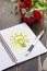 Idea book with pen and flower
