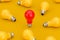 Idea Concept. One Red Light Bulb in Heap of Yellow Light Bulb. 3d Rendering