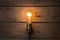Idea and leadership business concept, vintage incandescent light bulb on the wooden background