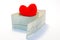Idea photo arrhythmias and heart diseases related to disorders of normal heart rhythm. Model red heart lies on top of the roll of
