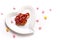 Idea for Valentine treats pretzel dip chocolate in ceramic heart shape plate on white background with copy space