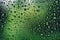 Ideal background of raindrops on the window, with a green backdrop, perfect for representing rainy days. Generative AI