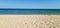 Ideal seascape - yellow sand, blue sea, blue sky