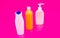 Ideal for your toiletries. Plastic bottles pink background. Multicolor toiletry bottles. HDPE