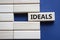 Ideals symbol. Wooden blocks with word Ideals. Beautiful deep blue background. Business and Ideals concept. Copy space