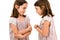 Identical twin girls sisters are arguing yelling at each other
