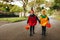 Identical twin girls trick or treating on halloween