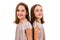 Identical twin girls are turned facing back to back