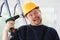 Idiot worker using electric drill portrait