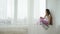 Idle leisure relaxed calm teen girl sitting window