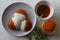 Idli half covered with podi chutney also named as gunpowder. Podi is made of ground pulses, dried red chillies and pepper