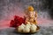 Idol of lord Ganesha with Modak Sweet Dish and flower. Ganesh chaturthi