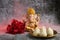 Idol of lord Ganesha with Modak Sweet Dish and flower. Ganesh chaturthi